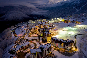 Night aerial view of the Ski Resort Rosa Khutor. A complex of hotels on the site of the former...