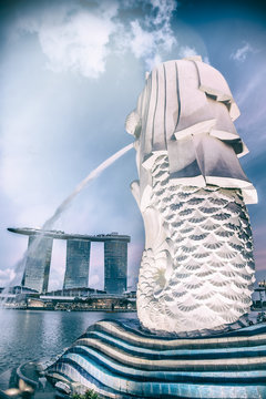 Singapore Merlion And City Skyline At Sunset