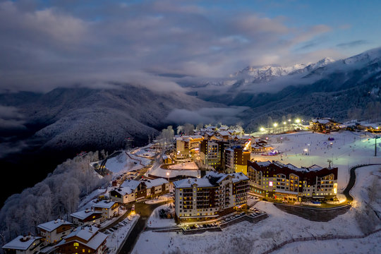 Night aerial view of the Ski Resort Rosa Khutor. A complex of hotels on the site of the former Olympic village of Rosa Plateau at an altitude of 1170 m from sea level. Krasnaya Polyana, Sochi, Russia