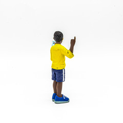 Isolated Disabled Young Black Deaf Boy Reading a Book. Good for Educational Purposes to Teach Children. Disability Toy Concept. Inclusive and Equal Opportunity Toy. - Photography
