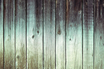 Faded wooden boards with corrosion. Cleaned wooden doors from several planks. Old natural wooden board without paint. Wooden background, copy space.