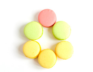 pastel colored macaroons in the shape of an Easter egg, creative minimalist Easter background
