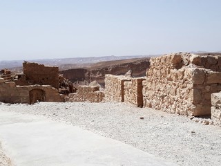 Ruins of the ancient Masada, a mountaintop fortress, near the Dead Sea in Israel. It was built by...
