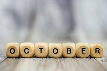 The word October on wooden cubes. Month of year