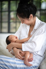 Mother is hugging and showing love to baby