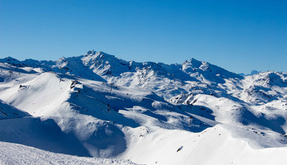 Fototapeta na wymiar Meribel mottaret val thorens peak view sun snowy mountain landscape France alpes 3 vallees