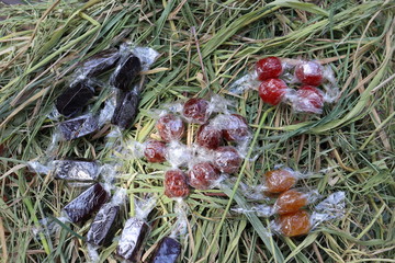 Candy on the straw background