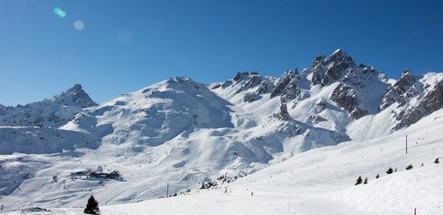 Naklejka na ściany i meble Pic de Saulire courchevel panoramic view cabin station view grand couloir black slope sunset snowy mountain landscape France alpes