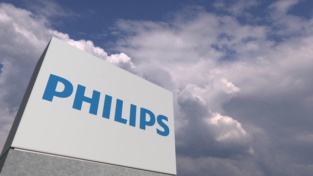 Logo of PHILIPS on a stand against cloudy sky, editorial 3D rendering