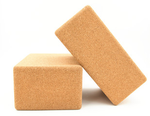two cork yoga blocks isolated on a white background