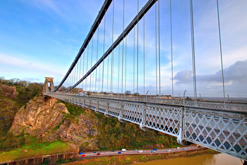 View in a winter sunset of the Clifton Suspension Bridge, a suspension bridge spanning the Avon Gorge and the River Avon in the city of Bristol, UK