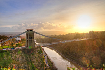 Plakat View in a winter sunset of the Clifton Suspension Bridge, a suspension bridge spanning the Avon Gorge and the River Avon in the city of Bristol, UK