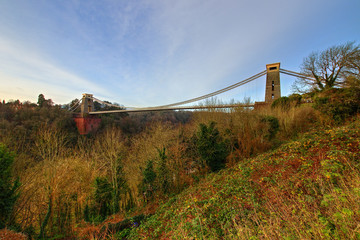 View in a winter sunset of the Clifton Suspension Bridge, a suspension bridge spanning the Avon Gorge and the River Avon in the city of Bristol, UK