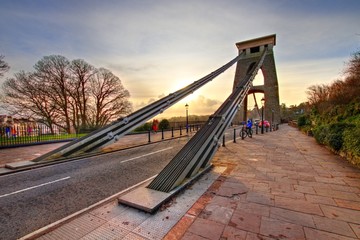 Fototapeta premium View in a winter sunset of the Clifton Suspension Bridge, a suspension bridge spanning the Avon Gorge and the River Avon in the city of Bristol, UK