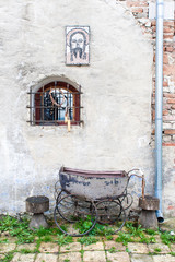 Rural scenery with picture of saint and old baby stroller, winemakers village Pavlov, South Moravia, Czech republic