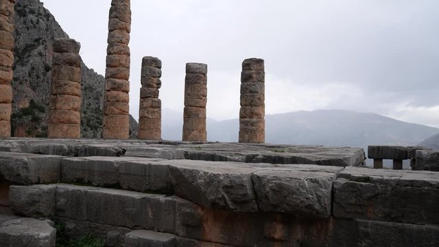 Ruins of the ancient temple of Apollo, archaeological site of Delphi along the slope of Mount Parnassus, UNESCO World Heritage, Greece.