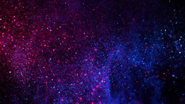 Super Slow Motion Shot of Neon Glitter Background at 1000fps.