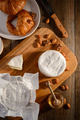 Delicious food on rustic wooden table, top view