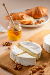 Cooking a puff pastry dessert. Cream cheese, nuts and honey for filling