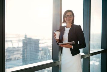 Fototapeta premium Her business day begins with a coffee and emails
