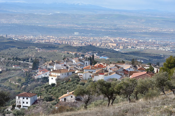 Fototapeta na wymiar Panoramic view of Viznar with Granada and its Vega in the background