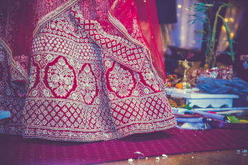 Indian hindu wedding and pre wedding ritual pooja items and hands close up