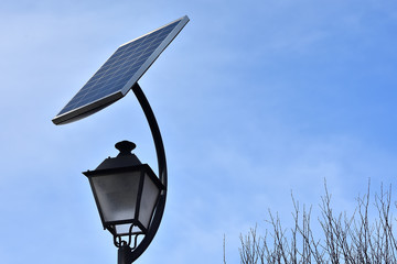 Clean energy: solar panels attached to the street lamps to provide light to a park