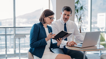 Discussing business together in the office