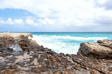 Fototapeta na wymiar Devil's Bridge bay - Caribbean tropical sea - Antigua and Barbuda.