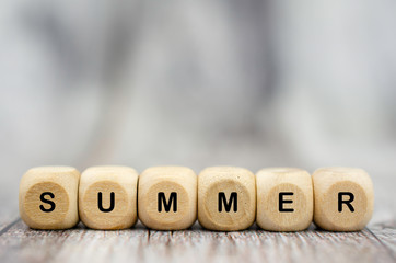 The word Summer on wooden cubes. Seasons of year