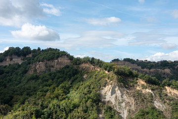 Fototapeta na wymiar Tuscany landscape with forests and cliffs seen from Bagnoregio, Italy. 