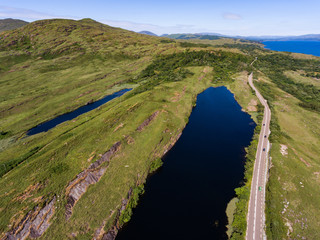 Fototapeta na wymiar Aerial view of road through scenic southern County Kerry in Ireland