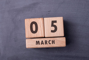 March 5 written with wooden blocks