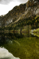 Fototapeta na wymiar Traunsee lake with forest in background located in Austria, Alpine region.