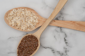 Seeds on a wooden spoon close up