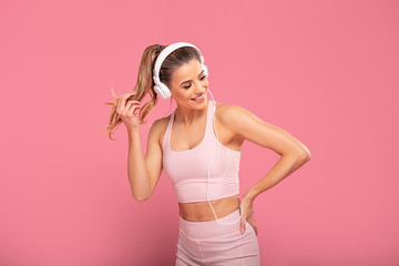 Obraz na płótnie Canvas Sporty Woman In Headphones.
