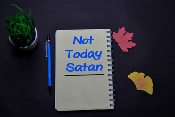 Not Today Satan write on a book isolated on office desk. Christian faith concept