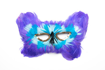 Purple blue white carnival mask with feathers isolated on a white background	
