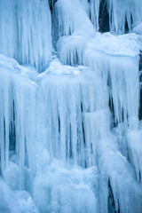 Icicles Hanging Down From a Hillside. Freezing temperatures make for an icy landscape along a mountain road in British Columbia, Canada.