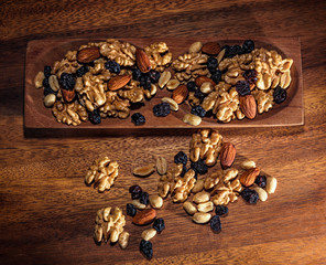 Walnuts, raisins, peanut and almonds.