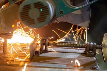 Metal cutting. Grinding steel. Work as a grinder. Sparks from friction. Men's work. Creating a...