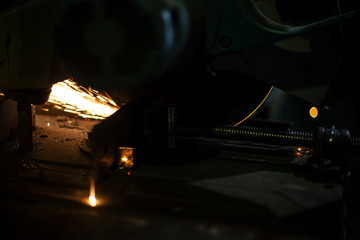 Metal cutting. Grinding steel. Work as a grinder. Sparks from friction. Men's work. Creating a...