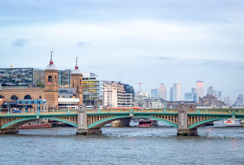 Obraz premium London Bridge view and London skyline along the River Thames on a cloudy December day