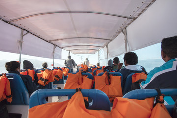 Fototapeta premium Passenger transportation with boat, taxi boat trip from Abraao, on the tropical Ilha Grande to Angra dos Reis, in the south of Rio de Janeiro Brazil