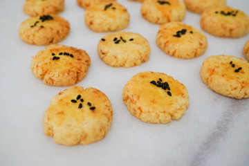 traditional homemade  coconut cookies with black sesame in white background 