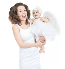 The happiness of motherhood. Mom laughs with her daughter, a little white angel with wings, isolated at white background