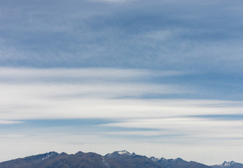 Clouds over the top of a mountain range
