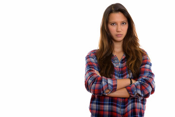 Fototapeta premium Studio shot of young beautiful woman with arms crossed