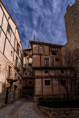 Fototapeta na wymiar Aerial panorama view of Albarracin in Teruel Spain, with red sandstone terracotta medieval houses, Moorish castle and ancient city walls voted most beautiful Spanish village