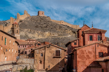 Aerial panorama view of Albarracin in Teruel Spain, with red sandstone terracotta medieval houses, Moorish castle and ancient city walls  voted most beautiful Spanish village